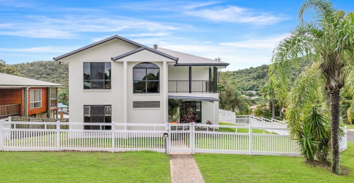 Queensland home with white Nosey Nelly PVC picket fence and gate at front yard